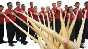 Adult Kung Fu And Martial Arts/MMA Practitioners Pointing Forward Bamboo Sticks As Weapons For Self Defense/Self-Defense Classes